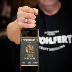 Craft Distiller Holding Coffee Liqueur Bottle Connects Maker With Her Target Audience